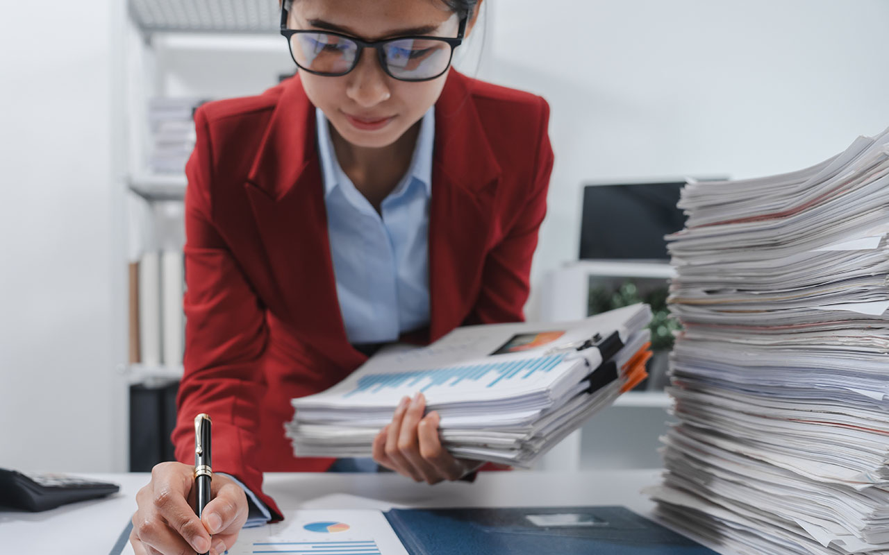Young woman reviewing contracts