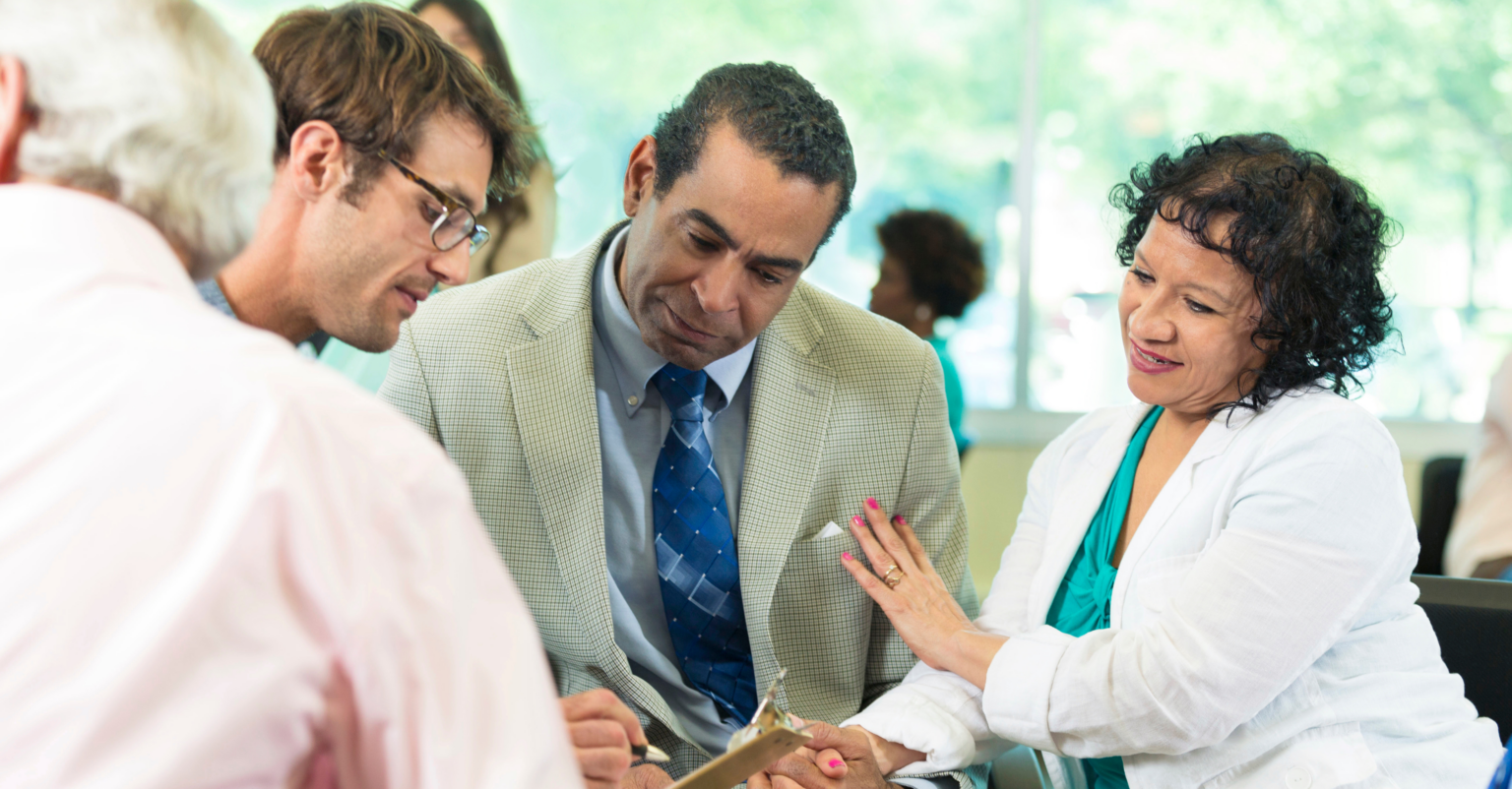 Team of caregivers, consulting on resources for client