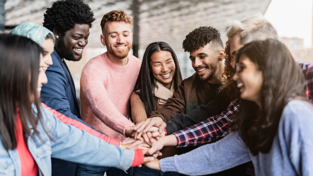 diverse co-workers in team huddle